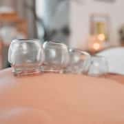 Cupping, therapy and wellness for body in spa, health and healing with alternative medicine. Body care, stress relief and balance, holistic and massage therapy, vacuum banks and healthy treatment.